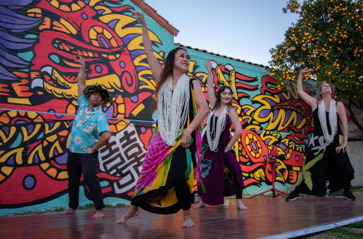 The Hula Anyone group dances in front of DJ Javiers mural curated for the Year of the Dragon festival on Feb. 10 in Santa Barbara, Calif. The mural was designed with Asian American and Pacific Islanders heritage in mind, thoughtfully stationed on one of the original Santa Barbara Chinatown buildings, now home to the Pickle Room. 