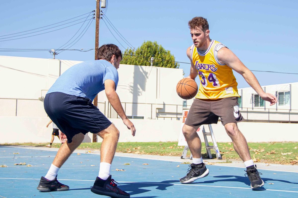 Alex Pagan crosses over his defender on Sept. 20 at City College's basketball club's 3v3 tournament at Estero park in Isla Vista, Calif. The Basketball Club plans monthly tournaments, and each player pitches in money to reward the winning team.