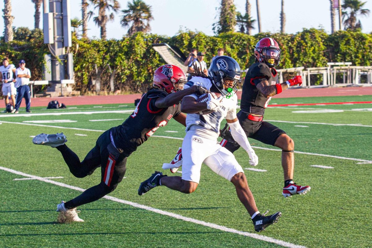 Sean Mays, left, hauls down a Fullerton player on Sept. 7 at La Playa Stadium at City College in Santa Barbara, Calif. Mays had two tackles and one broken up pass for the game.