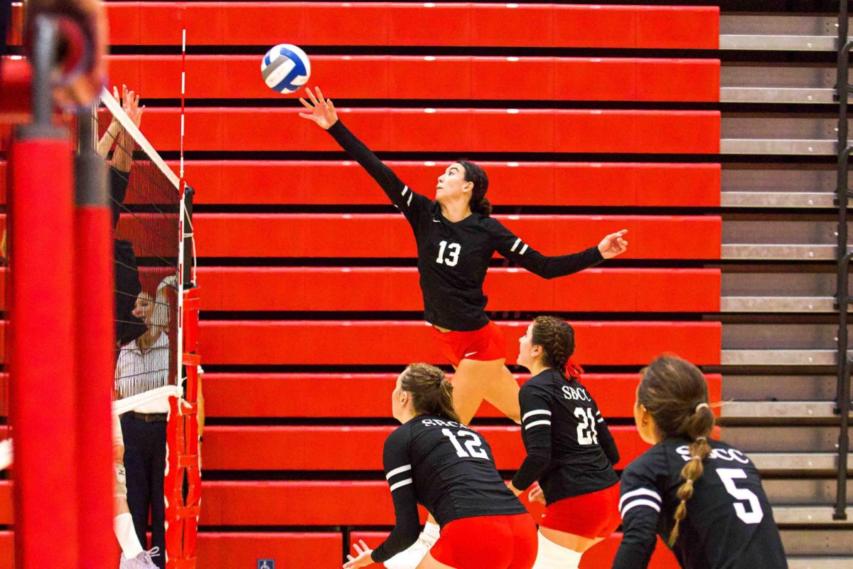 Kaylin Cooney stretches her arm to tip the ball over the net at the Sports Pavilion at City College on Sept. 6, 2024 in Santa Barbara, Calif. Cooney is a Santa Barbara native, and a graduate of San Marcos Highschool.