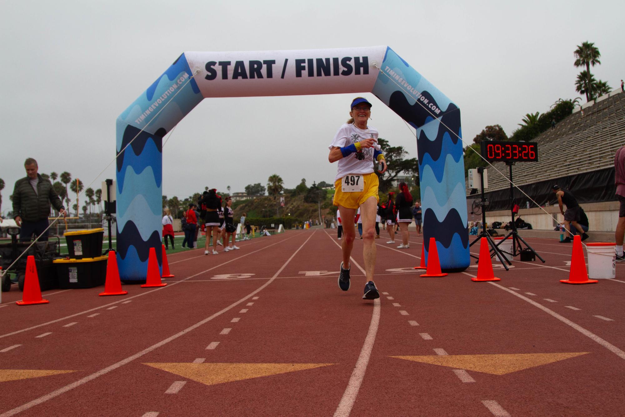 Cornelia Alsheimer-Barthel, accounting and finance professor at City College since 2011, finishes the race radiating with joy on Sept 28. at Santa Barbara, Calif. City College held its first annual Stampede and plans to make it a yearly tradition.