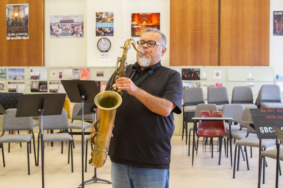 Andrew Martinez shows off his saxophone skills on Oct. 3 at City College's music room. Martinez has been playing the saxophone since Junior High School and attributes it to keeping him young. 