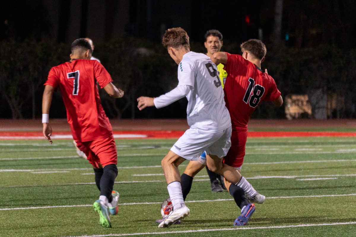 Kevin Zendejas, No. 7, and Uli Sevilla, No. 18, run after the ball against Golden West player Jorge Orozco on Nov. 20, 2024 at the La Playa Stadium at City College in Santa Barbara, Calif. Zendejas shot and scored one of the goals for the Vaqueros.