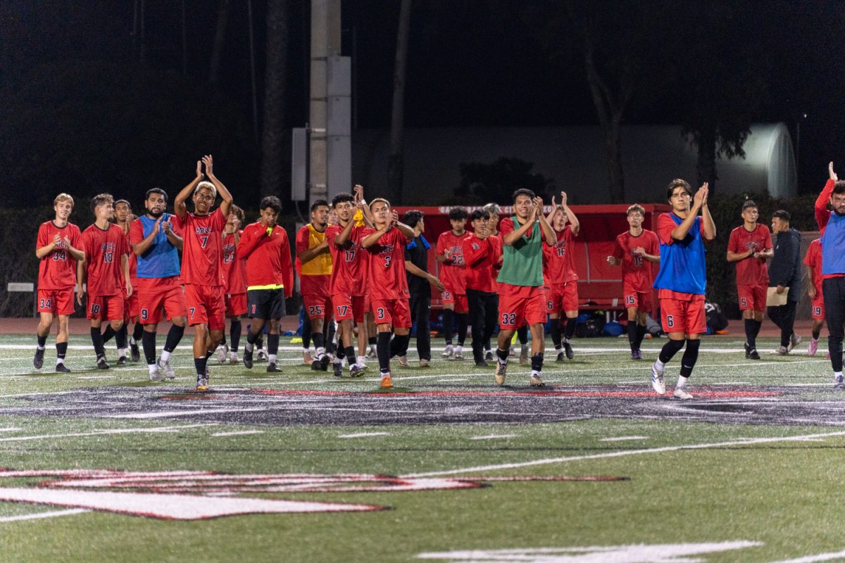 The men’s soccer team cheers after winning the game against Allan Hancock College at the La Playa Stadium at City College on Oct. 15 in Santa Barbara, Calif. The Vaqueros won the game with a score of 2-1.