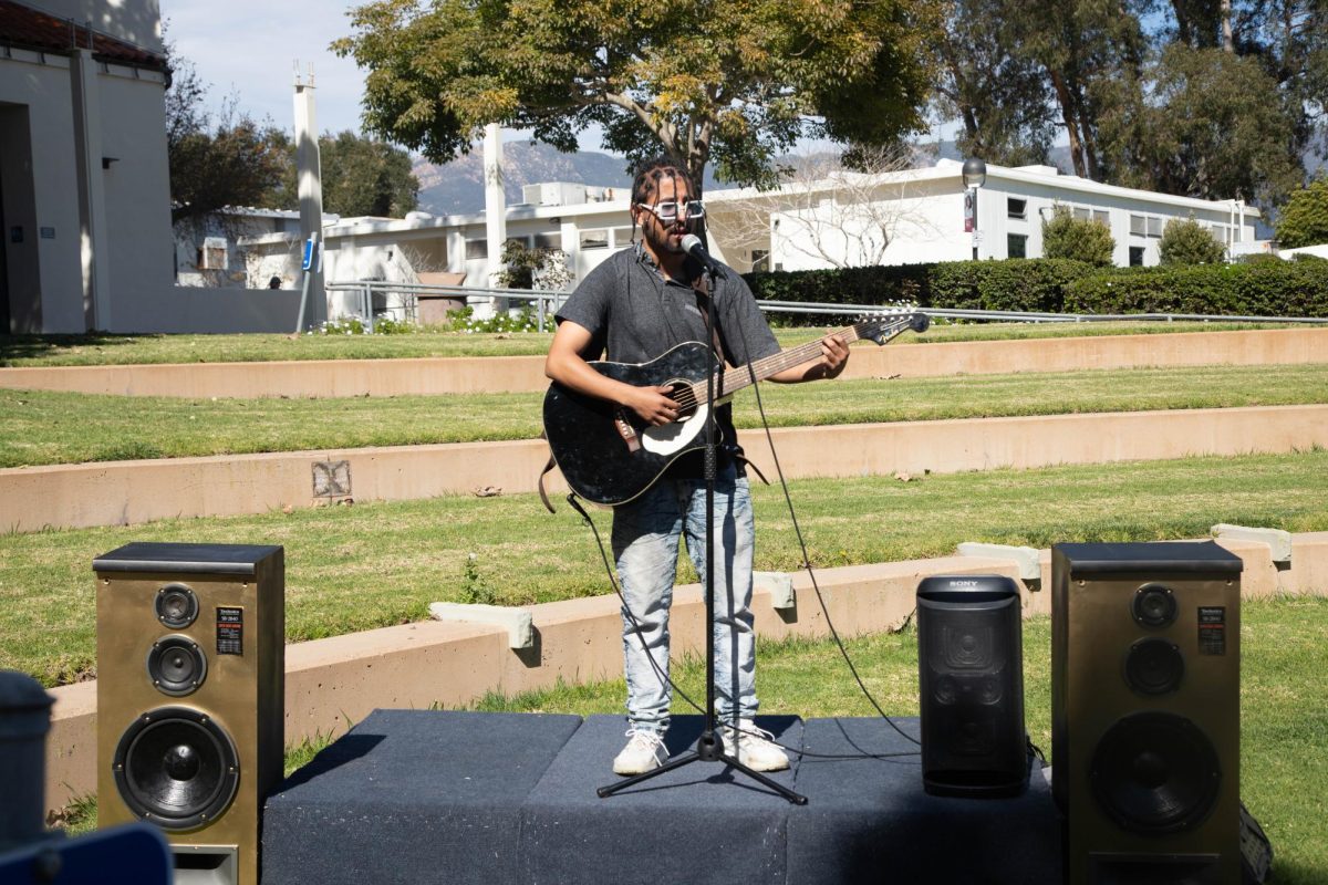 Club day takes place on Feb. 19 on the East Campus in Santa Barbara, Calif. Marlon Dorantes, member of the Music Club, preforms on stage. 