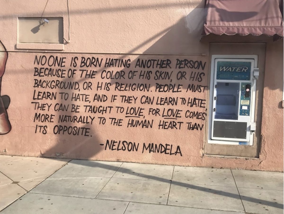 Quote by Nelson Mandela painted in 2020 by artist Danny Meza on the wall outside of Brownie's Market on De La Vina Street. Nelson Mandela was a South African anti-apartheid activist and politician who served as the first president of South Africa from 1994 to 1999.