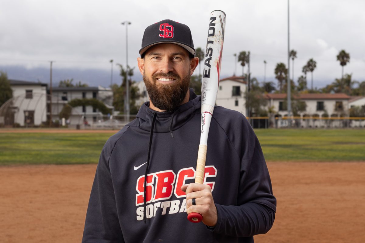 Tyler Heil holds a bat shortly before practice Feb 4. at Pershing Park in Santa Barbara, Calif. “I would say I’m pretty mellow. I’m analytical, there’s a lot going on in my mind but not a whole lot going on physically. There’s strategy, i’m trying to figure out what pieces are gonna work together,” Heil said when asked on his coaching style.