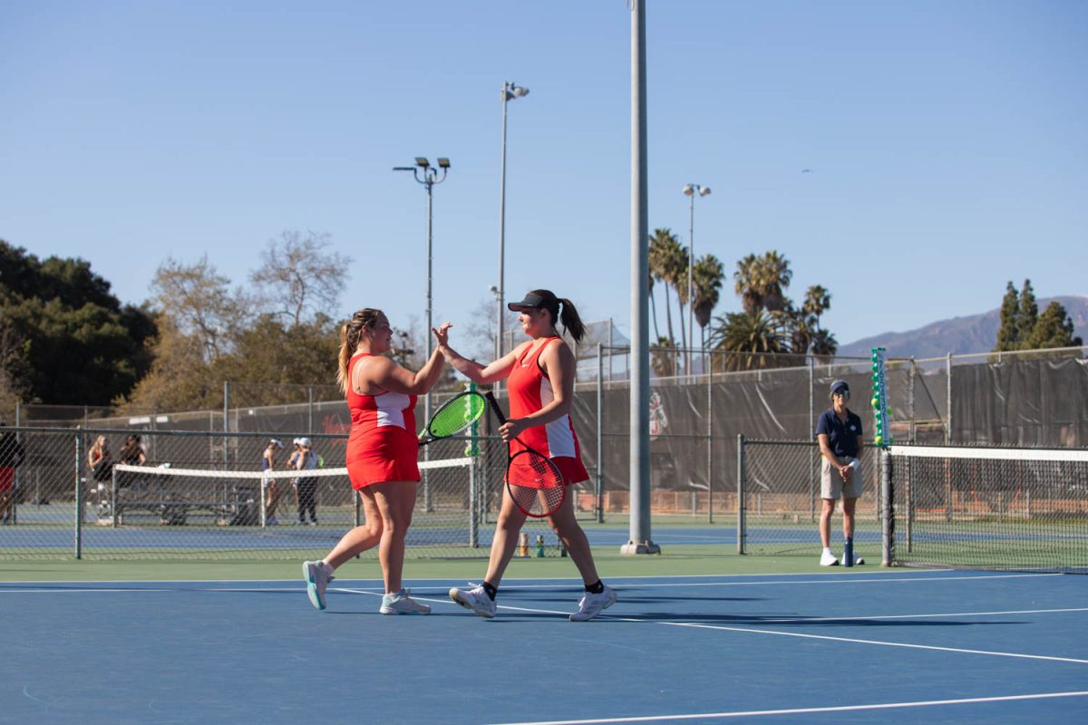 From left, Lela Fenstermaker and Ashley Birch high five after the round on Feb. 27 in Santa Barbara, Calif. Fenstermaker and Birch played together for the first time, since their doubles partners Jana Leowald and Sierra Bolanos were unable to play.